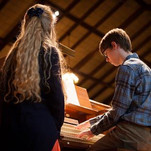 A student playing the organ
