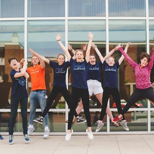 A group of Awakening students jumping in the air