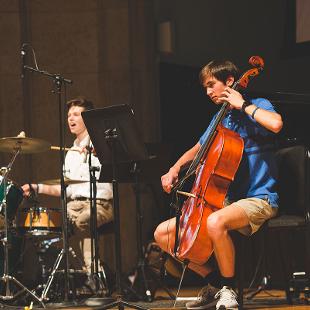 Students playing the cello and drums