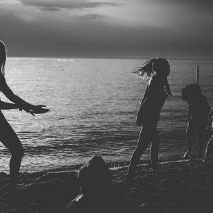 Students dancing on the beach